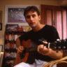 Chris Hauge plays guitar, 1992.